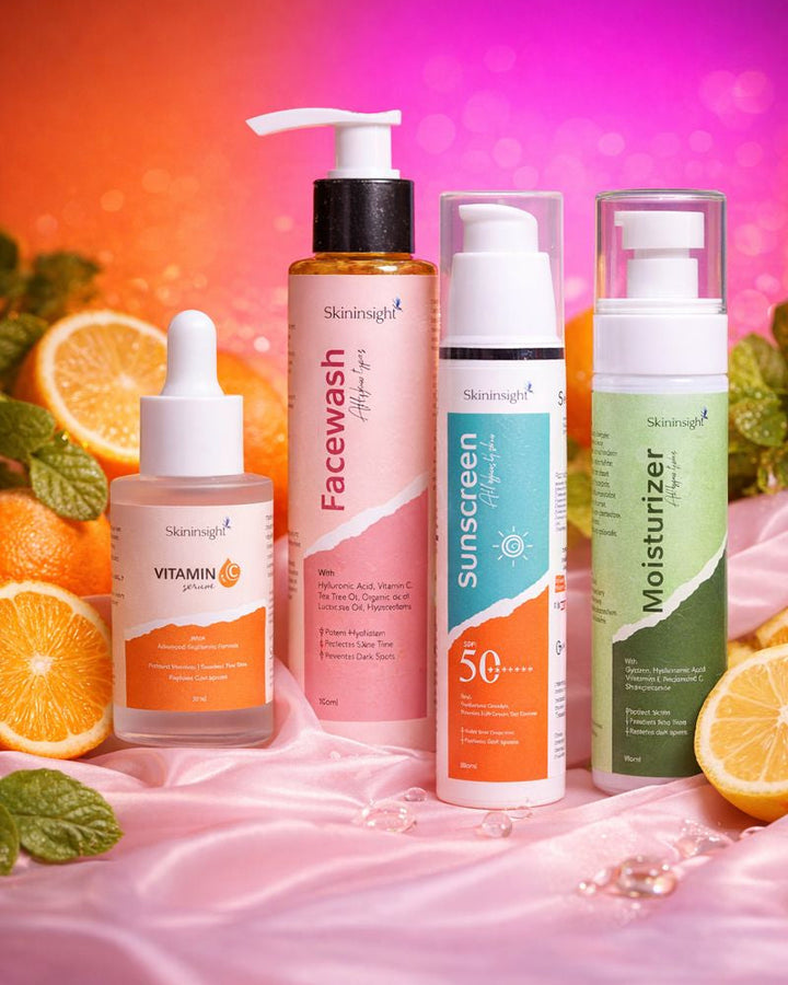 Collection of skincare products with colorful packaging on a pink fabric background.